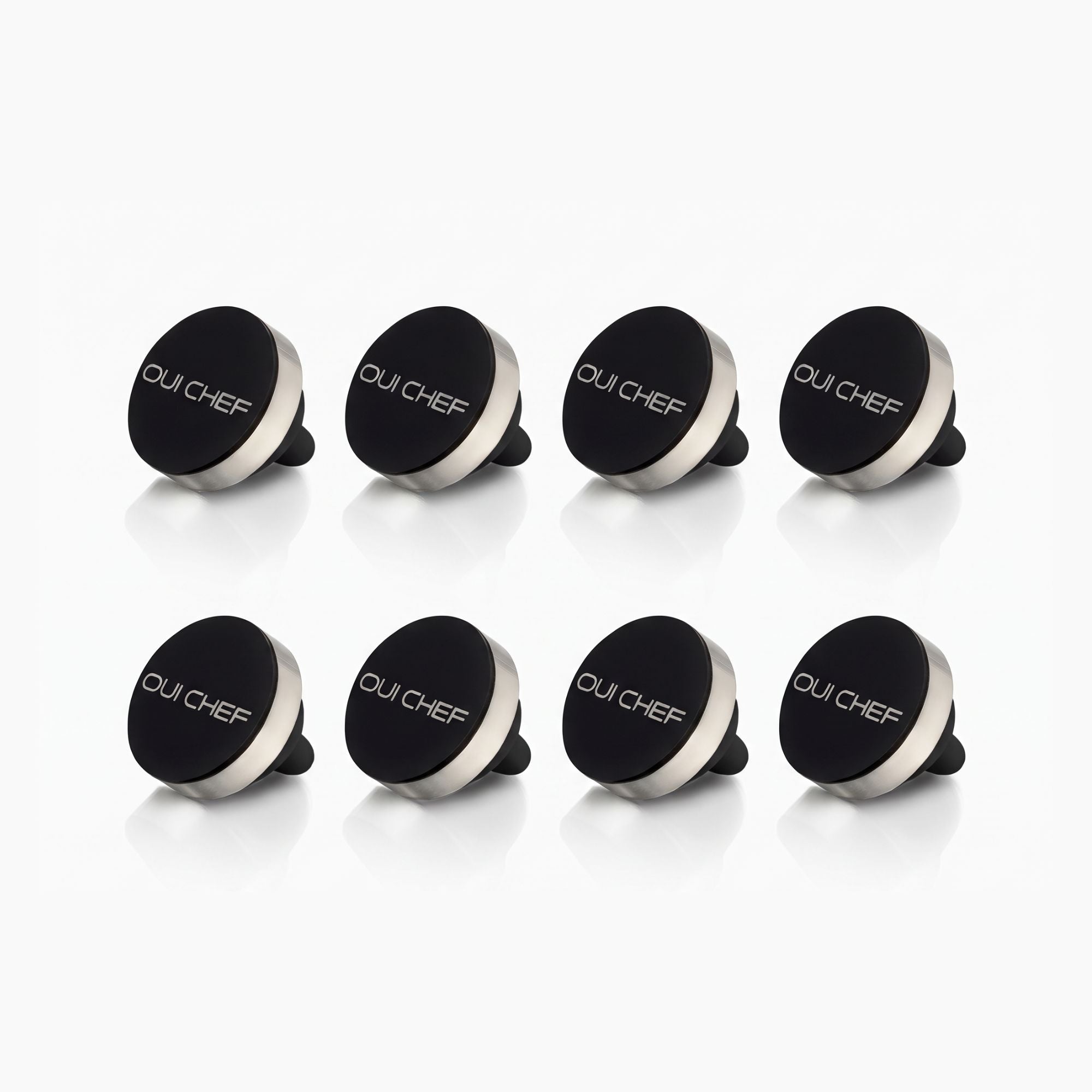 Oui Chef HoldFast Magnetic Chef's Pin 8 Pack with four black magnetic pins for chef jackets and aprons on a white background.
