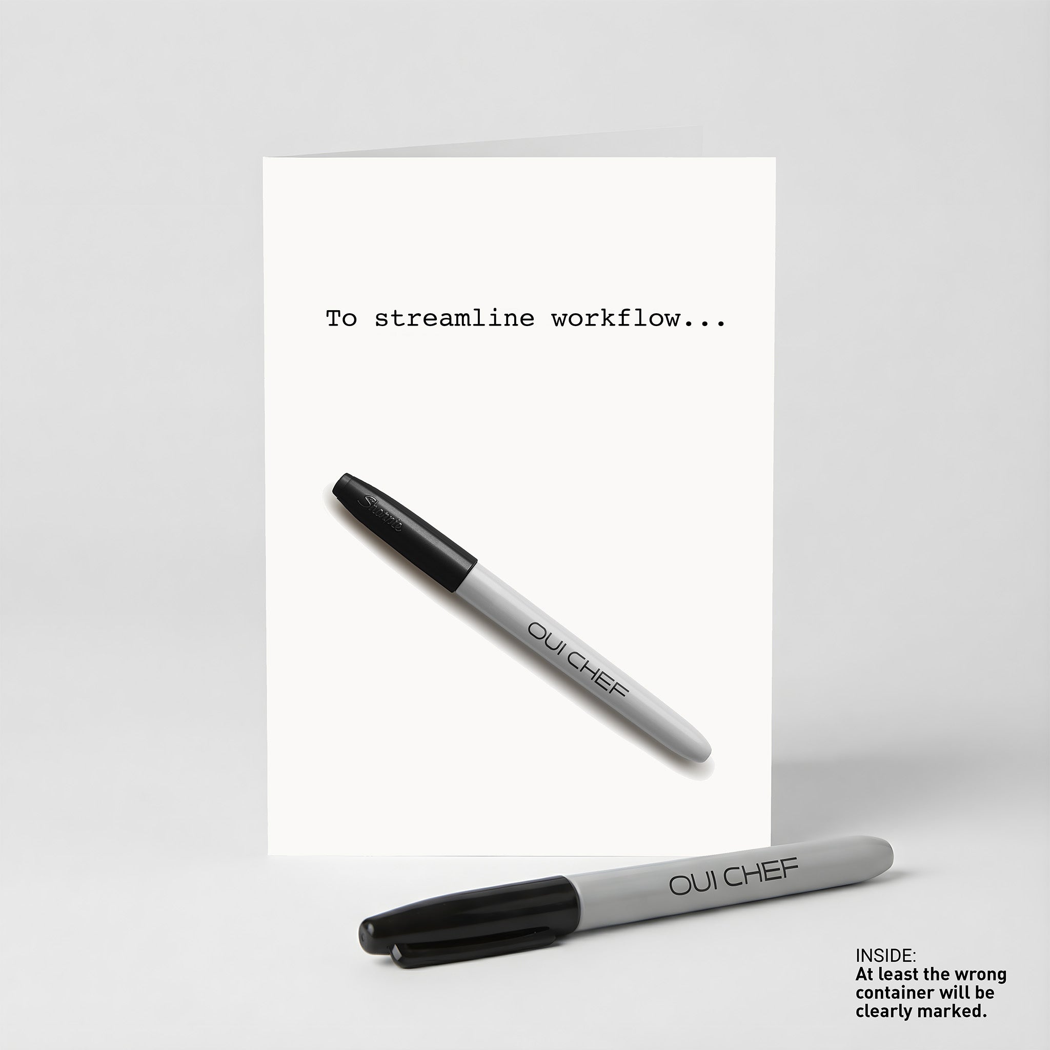 Oui Chef " To Streamline Workflow" Greeting card standing against a white background with a sharpie placed beside it.