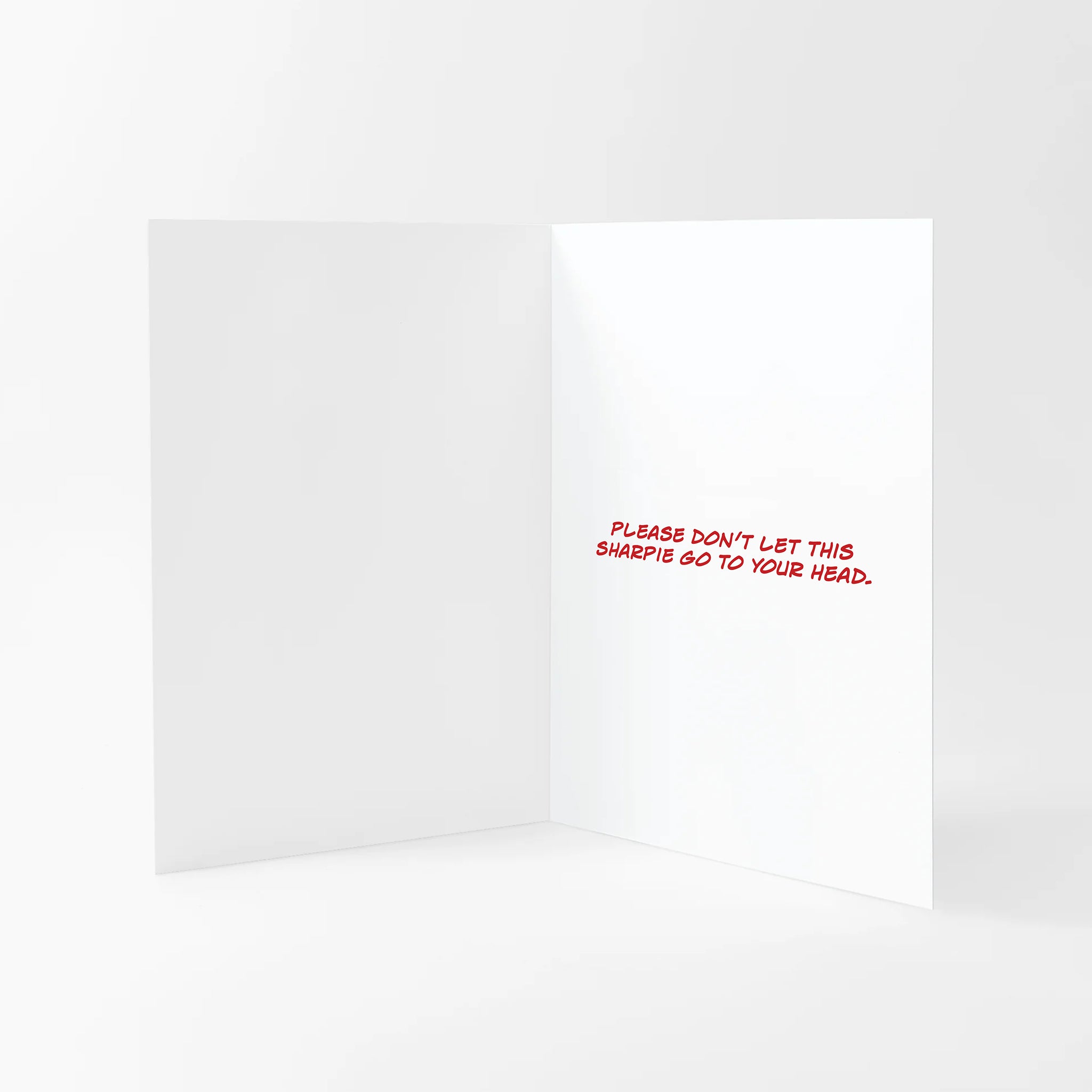 Valentines card with 'Please don't let this Sharpie go to your head' text on the inside on a white background.