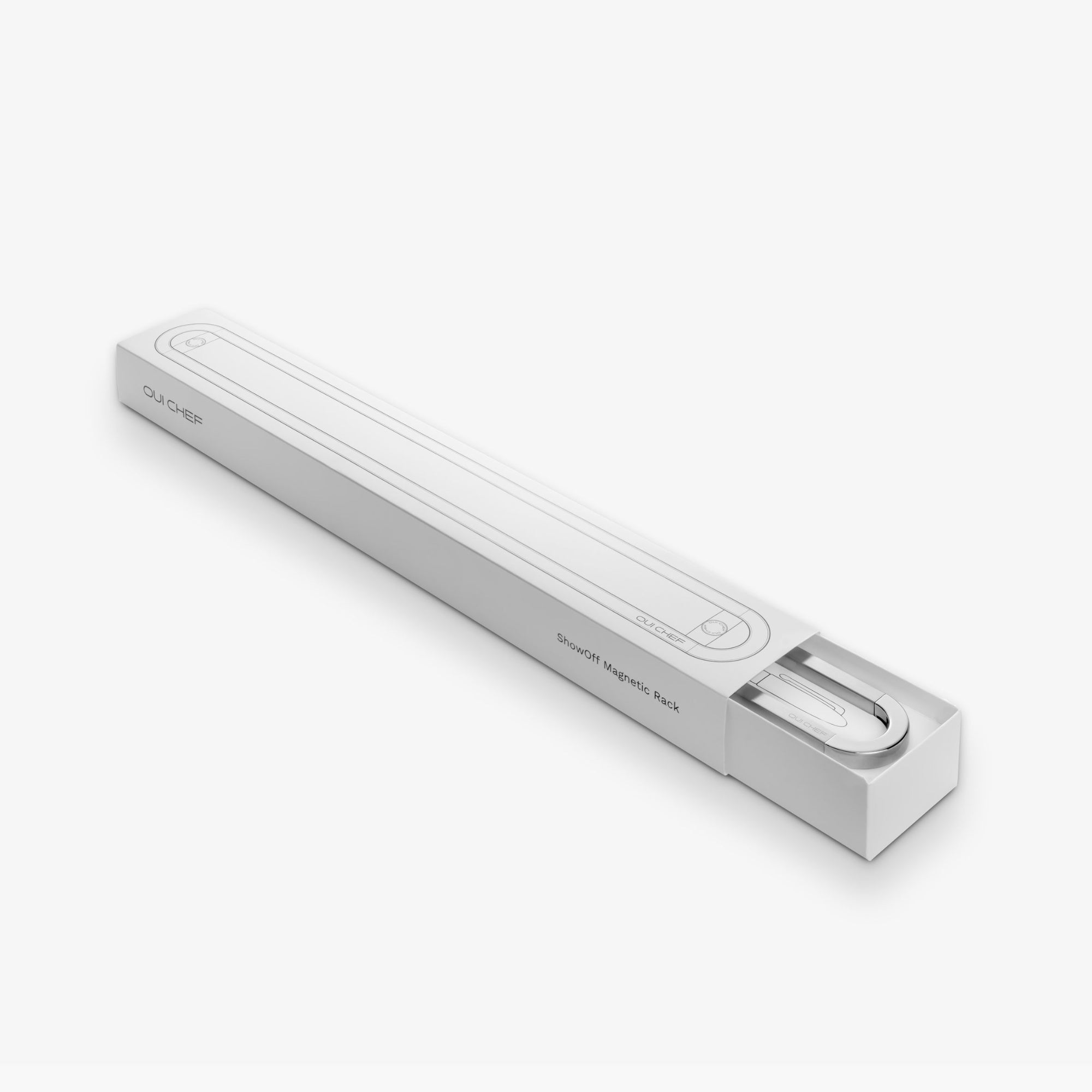 Stainless steel magnetic rack placed in the   packaging against a white background.