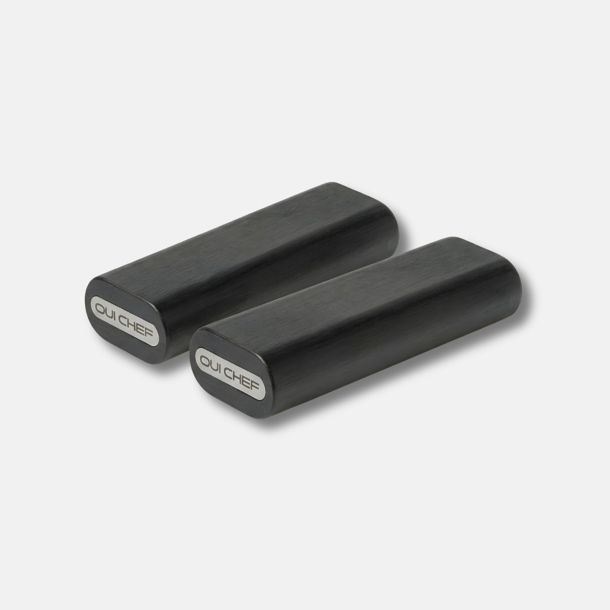 Two Modular laylow knife rests side by side sitting against a white background with the "oui chef" logo displayed on the side.